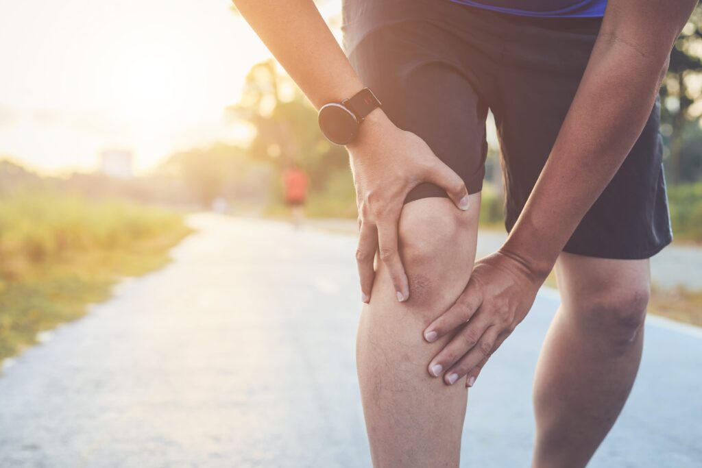 Signs Your Might Benefit From Rolfing - Man with injured knee